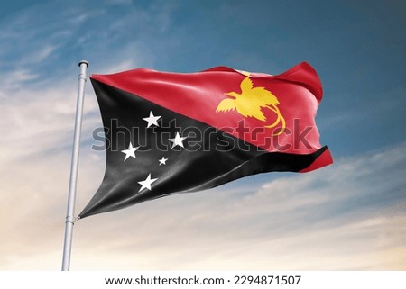 Waving flag of Papua New Guinea in beautiful sky. Papua New Guinea flag for independence day. The symbol of the state on wavy fabric. Royalty-Free Stock Photo #2294871507