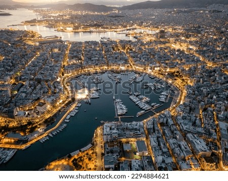 Aerial view of the illuminated Zea Marina in Piraeus, Athens, Greece, with lined up sailing boats and yachts during evening Royalty-Free Stock Photo #2294884621