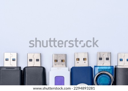 USB flash drive for computer several different pieces at the bottom of the screen on a light background
