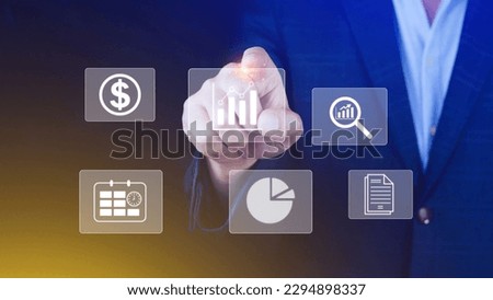 Big data analytics and business intelligence BI concept with chart and graph icons on digital screen interface and business people in the background.