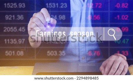 Earnings season Hand touching of written in search bar with the financial data visible in the background,  Reports Stock Market Ticker Words