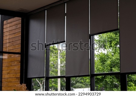 Gray blind or curtains on the glass window Royalty-Free Stock Photo #2294903729