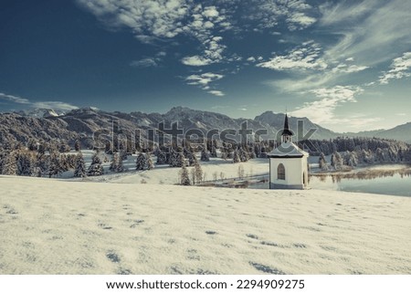 Church in front of the Mountainside and a beautiful winter wonder land Royalty-Free Stock Photo #2294909275