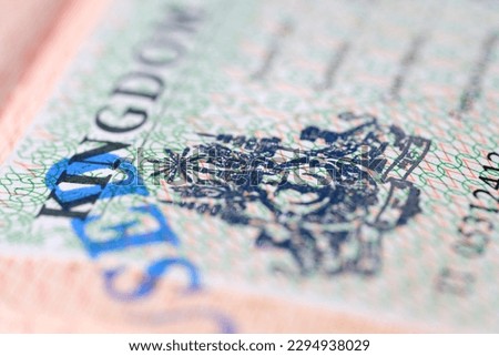 close-up part of page of document, foreign passport for travel with Sri Lanka visa, tourist visa stamp with hologram with shallow depth of field, passport control at border, travel in Southeast Asia