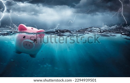 Piggy Bank At Risk To Drowning In Debt - Crisis Financial Banking Concept-  Contain 3d Rendering Royalty-Free Stock Photo #2294939501