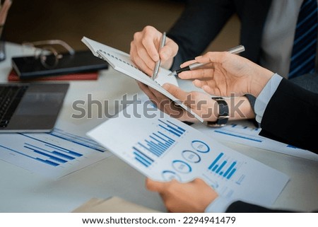 Business partners use laptops to analyze company financial budget reports, graphs and progress of work, costs and planning for the future in the office, meeting ideas.


 Royalty-Free Stock Photo #2294941479