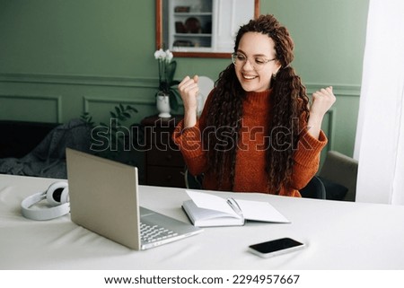 Happy Woman Winning Online: Receiving Good News via Email on Laptop. Excited Student Celebrating Success on Laptop Job Approval and Achievements Triumphant Student Winning Job Approval Overjoyed Woman Royalty-Free Stock Photo #2294957667