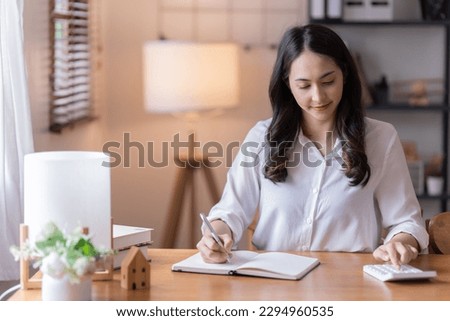Full length photo of positive business girl sits floor legs crossed folded work remote laptop read document report hold mug beverage in house