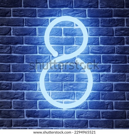 Glowing neon number 8 sign on brick wall