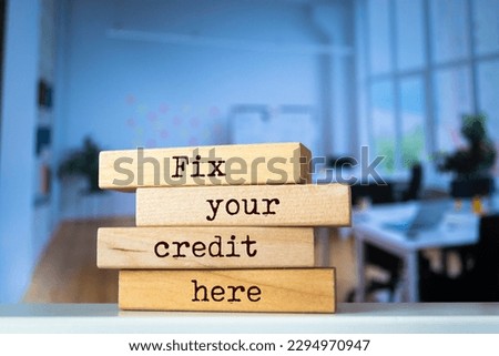 Wooden blocks with words 'Fix your credit here'. Business concept