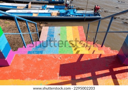 Stairs colorful rainbow or freshwater lake. Way down go to canal by  in one of tourist attractions in Thailand. Rainbow is symbol LGBTQ is term to refer to people of different gender is diverse group.