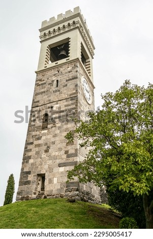 View of the tower of the church of San Michele in Castello in Fagagna. October 2022 Fagagna, Friuli Venezia Giulia, Italy