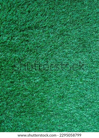Green artificial grass background or texture