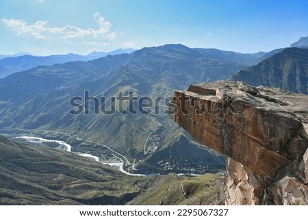 High mountain "troll tongue" rock in Goor, Dagestan Republic of Russia Royalty-Free Stock Photo #2295067327