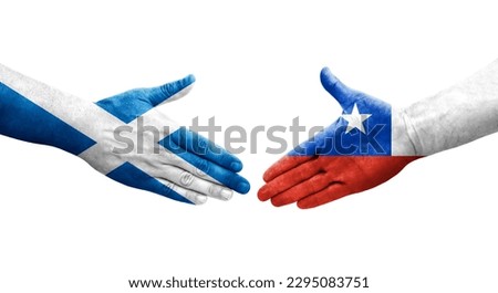 Handshake between Chile and Scotland flags painted on hands, isolated transparent image.