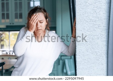 Young woman suffering from vertigo or dizziness problem of brain or inner ear Royalty-Free Stock Photo #2295097945
