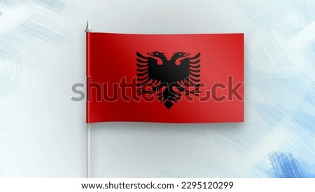 Albania  3D render flag on a blue texture background