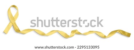 Photo of yellow ribbon with curled end isolated on a white background with clipping path.