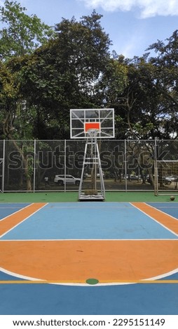 This is a picture of a half of an outdoor basketball court. 