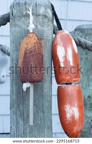 traditional and vintage lobster bouys in orange and brown