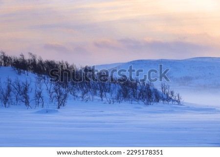 Majestic sunset over winter landscape with in Lapland, Finland, Europe