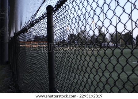 a picture of a golfing range and a fence line