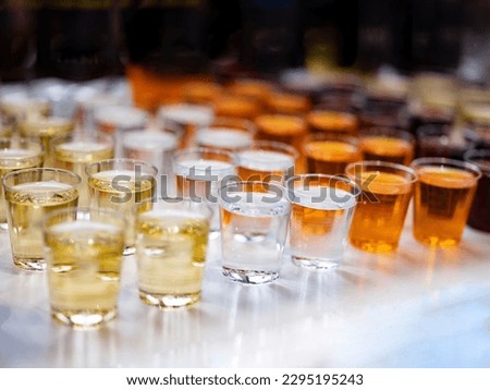 Assortiment of Strong alcoholic drinks, hard liquors, spirits and distillates in glasses: vodka, cognac, whiskey and other. Hard light copy space. Alcohol concept Royalty-Free Stock Photo #2295195243