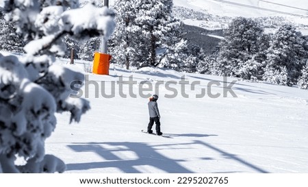 Exciting snowboarding captured in a stunning mountain setting. This impressive image is perfect for winter sports enthusiasts