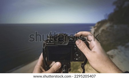 camera in hands from the first person, landscape photography POV
