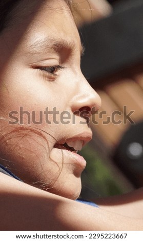 Close up of a young girl in sunlight 