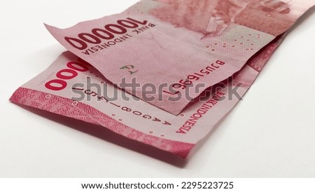 The old serial number and new serial number banknotes a one hundred thousand with isolated white background, no people