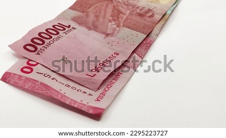 The old serial number and new serial number banknotes a one hundred thousand with isolated white background, no people
