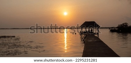 Sunrise in Bacalar Lagoon, Quintana Roo, Mexico Royalty-Free Stock Photo #2295231281