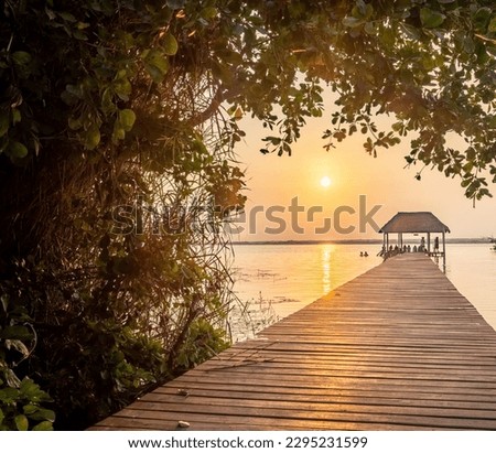 Sunrise in Bacalar Lagoon, Quintana Roo, Mexico Royalty-Free Stock Photo #2295231599