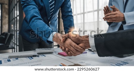 Business handshake for teamwork of business merger and acquisition,successful negotiate,hand shake,two businessman shake hand with partner to celebration partnership and business deal concept. Royalty-Free Stock Photo #2295260627