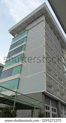 8 floors campus building with blue sky background