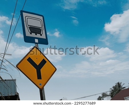 A picture of road sign in Central Borneo with clean sky background.