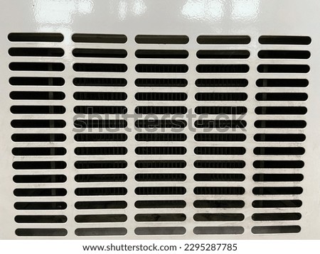 parallel perforated plate functions for the direction of wind exit from the refrigerator - stock photo
