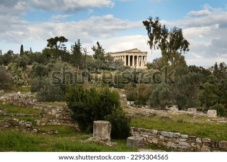 Temple of Hephaestus (Hephaisteion) in Agora of Athens, on top of the Agoraios Kolonos hill without people during sunny winter day took from Stoa of Attalos Royalty-Free Stock Photo #2295304565