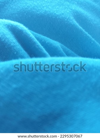 A worn blue soft cloth