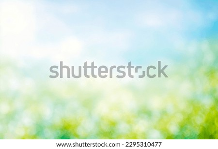Summer background of blue and green, blurred foilage and sky with bright bokeh. Blurry abstract summer background. Natural green leaves using as cover page greenery environment ecology background Royalty-Free Stock Photo #2295310477