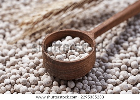 Granulated mineral fertilizer used in agriculture Royalty-Free Stock Photo #2295335233