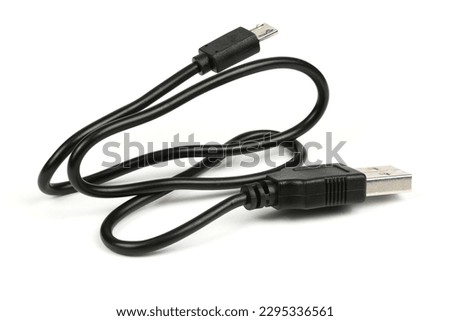 USB Cable for mikrocut. Black USB cable for charging a smartphone isolated on white. Side view. High resolution photo. Full depth of field. Royalty-Free Stock Photo #2295336561