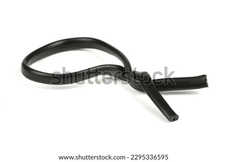 Black plastic coated wire tie used for a variety of things isolated on white background. Side view. High resolution photo. Full depth of field.
