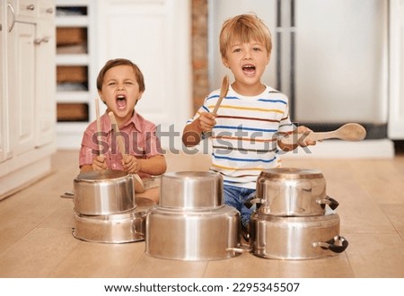 Children, playing and pots for music or noise in family home or kitchen for happiness, fun and portrait. Male kids or friends together for a portrait, play and drum instrument for freedom and fantasy Royalty-Free Stock Photo #2295345507