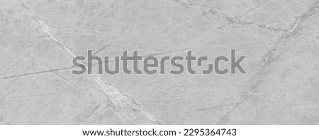 Light gray low contrast texture. Old stained marble wallpaper for design work with copy space.
