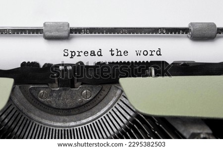 Text Spread the word typed on retro typewriter