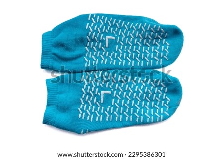 A pair of non slip slipper socks for patients in hospital and care home residents isolated in white. Royalty-Free Stock Photo #2295386301