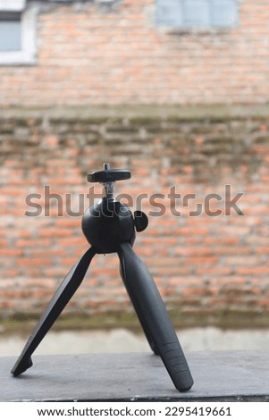 small camera tripod isolated blur background