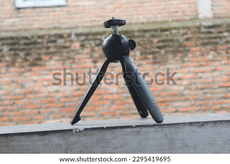 small camera tripod isolated blur background